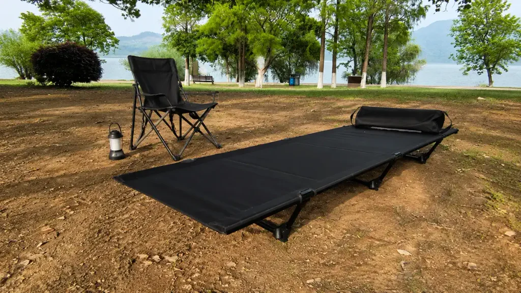 Low-profile lightweight camping cot with compact folding structure