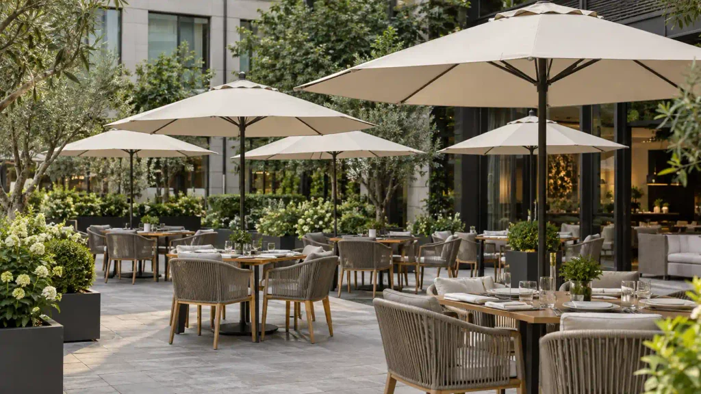 Outdoor Umbrellas Outdoor umbrellas installed in a hotel courtyard dining area for commercial use