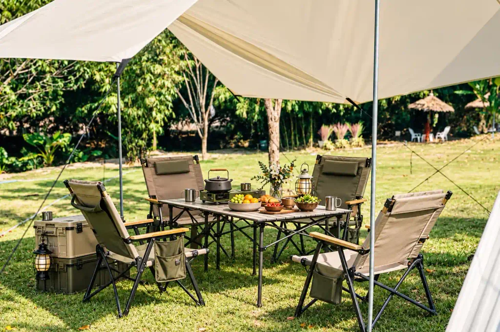 Services Camping furniture and outdoor equipment displayed at a campsite